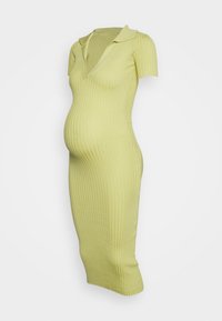Vestido de maternidade curto, justo, com mangas curtas e canelado, na cor verde claro, com decote em V e gola. Comprimento até aos joelhos com um acabamento texturizado.