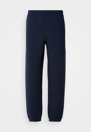 Marineblauwe joggingbroek van zachte stof, met een elastische tailleband en taps toelopende pijpzomen voor een comfortabele pasvorm. Geen zichtbare logo's of patronen.