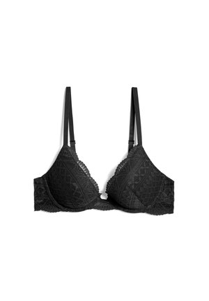 Bralette en dentelle noire avec des bonnets triangulaires, des bords festonnés et des fines bretelles réglables. Présente des motifs géométriques complexes sur l'ensemble.