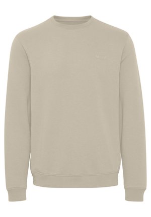 Beige sweatshirt met lange mouwen, geribbelde manchetten en ronde hals. Subtiel logo op de borst. Gemaakt van zachte, gestructureerde stof.