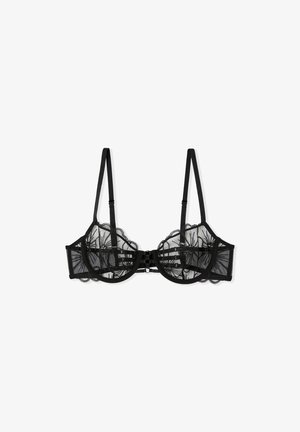 Soutien-gorge en dentelle noire avec des panneaux en mesh transparent, des bords festonnés, des bretelles réglables et une fermeture par crochet et œillet pour un ajustement et un soutien optimal.