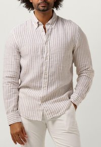 Lichte linnen shirt met verticale beige en witte strepen, met een button-down kraag en lange mouwen. Voorzien van een subtiele textuur en knopen aan de voorkant.