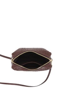 Brown woven leather crossbody bag with gold zipper, spacious interior, and slim strap. Interior features a soft black lining.