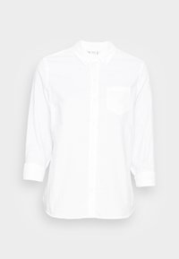Camicia bianca a maniche lunghe in cotone. Caratterizzata da una chiusura con bottoni, colletto a punta, taschino sul petto e polsini arrotolati. Texture liscia.