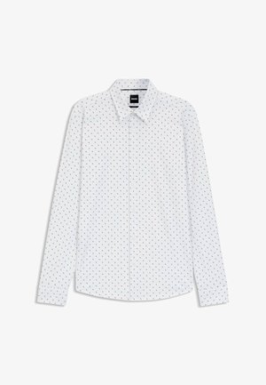 Camisa blanca de manga larga con cuello abotonado, con un pequeño patrón rojo y azul en toda la prenda. Tejido de algodón, corte estándar.