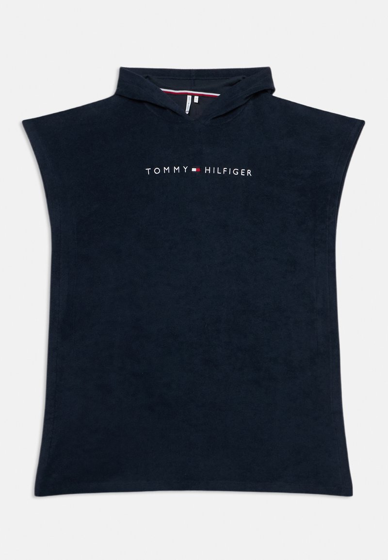 Ναυτικό μπλε ποντσο με κουκούλα από μαλακό πετσέτο ύφασμα, με το λογότυπο "TOMMY HILFIGER" σε λευκό στο στήθος. Φαρδιά κοπή, χωρίς μανίκια.