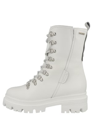 White leather ankle boot with lacing, silver hardware, and a chunky rubber sole. Features a rear pull tab and reinforced stitching details.