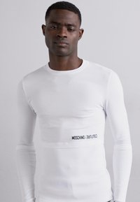 MOSCHINO Ilgarankovis viršutinės dalies drabužis - fantasia bianco