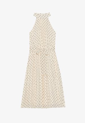 Robe sans manches de couleur crème avec un col halter ; présente des pois bruns, une taille cintrée avec une ceinture à nouer, et un design de jupe fluide.