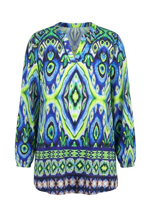 Blouse à manches longues avec col en V et motifs géométriques abstraits symétriques en bleu, vert et noir vibrants.