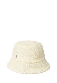 Cream-colored bucket hat with a soft, textured fleece fabric and a small white brand tag on the side.
