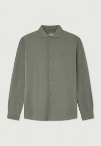 Chemise à manches longues à boutons de couleur vert olive, composée d'un tissu doux avec une texture lisse. Elle possède un col et un logo subtil sur la poitrine.