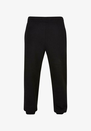 Sorte sweatpants lavet af blødt stof, med elastisk talje, snævre ben og manchetter ved anklerne. Ingen synlige mønstre eller accenter.
