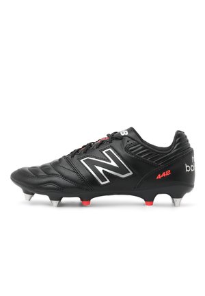 Black leather soccer cleat with red and silver accents. Features a textured upper, cushioned collar, and nine molded studs for traction.