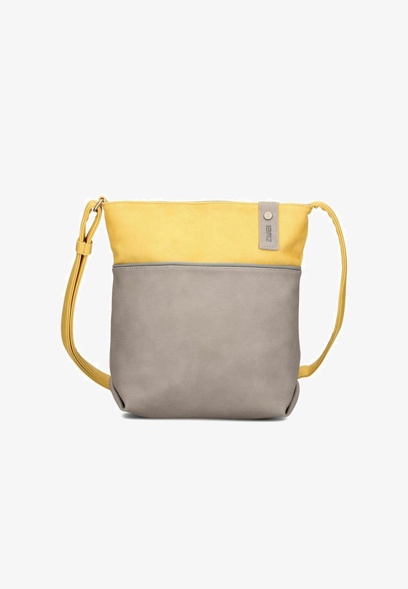 Sac bandoulière bicolore avec une partie supérieure jaune, une partie inférieure grise, une sangle jaune réglable et une petite étiquette en tissu en haut à droite.