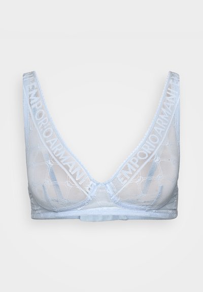 Bralette azzurro chiaro realizzato in tessuto trasparente con un motivo geometrico, caratterizzato da un bordo con logo lungo i lati e un design morbido e senza cuciture.