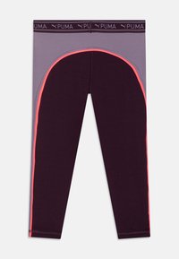 Leggings u tamnoljubičastoj boji sivoj elastičnoj traci. Imaju zakrivljeni bočni panel sa svijetlim neonskim narančastim akcentom. Glatki, rastezljivi materijal.