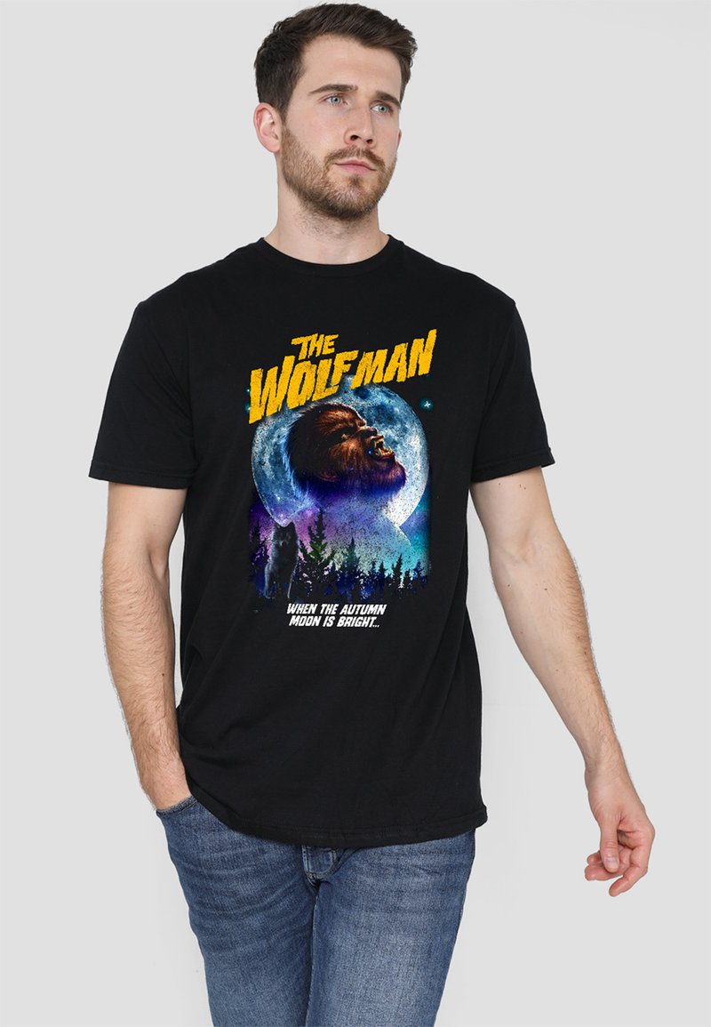 Black cotton t-shirt featuring a colorful graphic of a wolfman against a moonlit background, with text above and below the design.