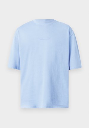 Light blue cotton t-shirt with a round neck, short sleeves, and a subtle logo printed in the center upper back. Regular fit, smooth texture.