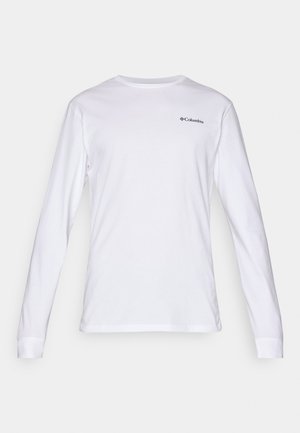 Langärmliges weißes T-Shirt aus Baumwolle mit Rundhalsausschnitt und kleinem schwarzem Columbia-Logo auf der Brust. Weicher Stoff, figurbetonter Schnitt.