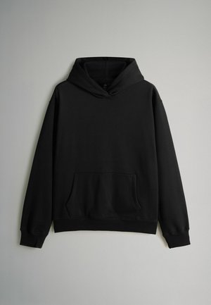 Svart luvtröja i bomullsblandning, med en framficka, dragsko huva, ribbade muddkanter och nederkant.