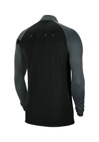 T-shirt Nike à manches longues avec un corps noir et des manches gris foncé. Tissu lisse, col haut et logo réfléchissant au dos.