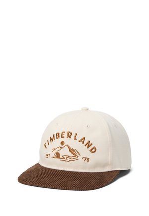Beżowa czapka bejsbolowa z brązowym sztruksowym daszkiem, z wyhaftowanym napisem "Timberland" oraz górskim logo z napisem "EST '73".