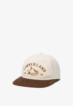 Beige baseballpet met bruine corduroy klep, voorzien van geborduurde "Timberland" tekst en berglogo met "EST '73".