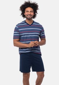 Striped navy v-neck t-shirt with red and light blue stripes, paired with navy shorts. Both made of soft, lightweight fabric.