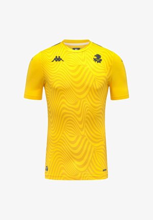 Maillot de sport jaune à manches courtes avec motif ondulé, emblème de lion noir sur la poitrine, et logos Kappa noirs sur la poitrine et les manches.