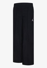 Pantaloni neri a gamba larga con elastico in vita. Presentano un logo bianco sul davanti. Il tessuto ha una texture stropicciata.