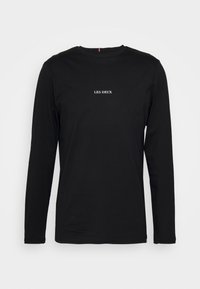 Schwarzes Langarm-T-Shirt aus Baumwolle mit einem weißen "LES DEUX"-Logo auf der Vorderseite, rundem Ausschnitt und lockerer Passform.