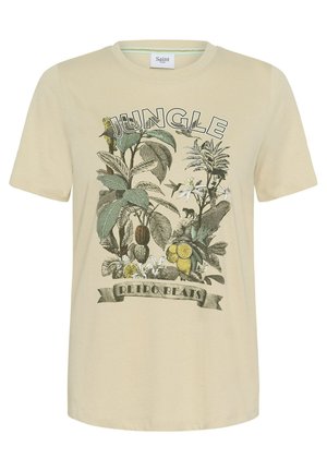 Béžové tričko s potiskem v džunglovém stylu, zobrazujícím velké listy, květiny, citrony, kolibříka a malou opici, s nápisy „Jungle“ a „Retro Beats“.