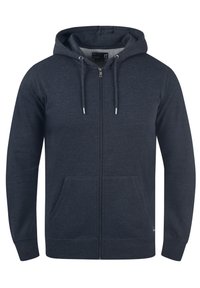 Sweat à capuche zippé bleu foncé avec poches avant, capuche à cordon et poignets côtelés, présenté sur un fond blanc uni.