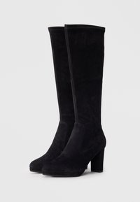 Black suede knee-high boots with a block heel, seamless design, and a rounded toe. Soft texture and smooth finish with no visible embellishments.