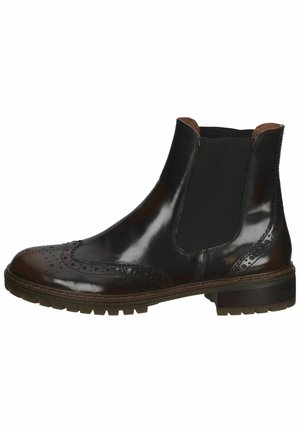 Sort læder Chelsea-støvle med brogue-detaljer, elastiske sidepaneler og en lav stablet hæl med en struktureret sål.