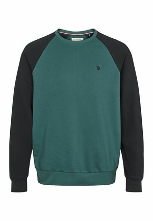 Zaļš apģērbs ar melniem raglanu piedurknēm, ribotām aprocēm un apakšmali, kā arī neliels izsist logo uz krūšu daļas. Mīksta auduma tekstūra.