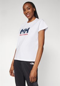Helly Hansen HH LOGO
 - Triko s potiskem - white