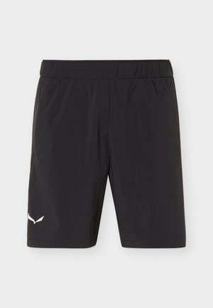 Pantalones cortos deportivos negros con cinturilla elástica y pequeño logo blanco en la parte inferior izquierda de la pierna, mostrados sobre un fondo claro y liso.