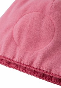 Pink fleece fabric with a textured surface and a circular reinforcement detail. The hem features a knitted border in a darker pink hue.