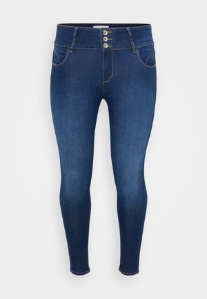 High-waisted, fitted denim jeans in dark blue with five-pocket design, visible stitching, and three-button closure at the waist.