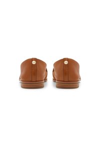 Pair of brown leather slip-on shoes with stacked wooden heels, viewed from the back on a white background.