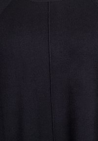 Black knitted sweater showing a smooth texture, with a rounded neckline and raglan sleeves, featuring a central seam on the back.