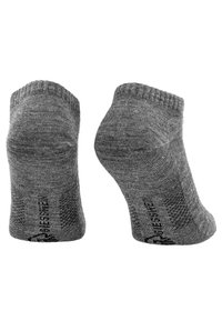 Graue Knöchelsocken mit einem weichen, strukturierten Strick. Gerippter Bund und verstärkte Ferse. Mit einem Muster und Logo an der Sohle.