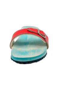 Red leather sandal featuring a single strap with a metal buckle, wooden footbed with a blue tint, and a textured black rubber sole.