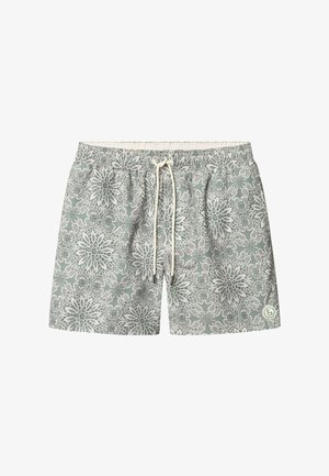 Grüne Badeshorts mit floralem Spitzenmuster, elastischem Bund, verstellbarem Kordelzug und Logopatch unten rechts.