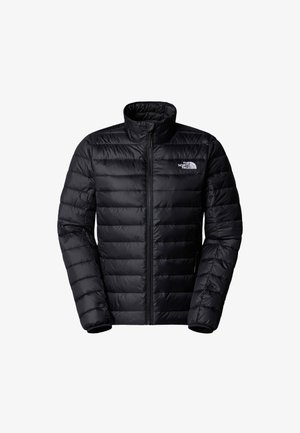 Musta puhvutakki korkealla kauluksella, tikattu muotoilu, täysipitkä vetoketju ja logo vasemmassa rinnassa. Sujuva, kevyt materiaali.