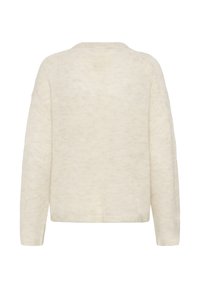 Gaiši bēšs adīts džemperis ar mīkstu tekstūru, apaļu izgriezumu kaklam, garām piedurknēm un vaļēju piegriezumu. Vienkāršs un minimālistisks dizains.