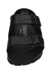 Black slide sandal with two adjustable buckles, made from smooth synthetic material, featuring a contoured footbed and textured sole.