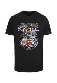 Black cotton t-shirt featuring a vibrant, printed graphic of characters from "Yu-Gi-Oh! GX" in a circular design with various colors.